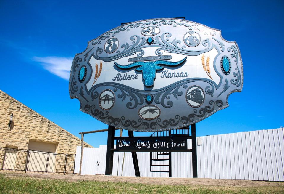 The World's Largest Belt Buckle in Abilene, Kansas, measures up at 19 feet 10 and 1/2 inches wide and 13 feet 11 and 1/4 inches tall (not including the frame).