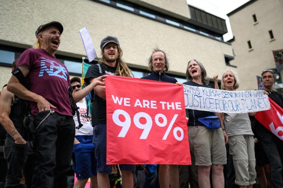 Protesters take part in a demonstration against the World Economic Forum (WEF) during the WEF annual meeting in Davos (AFP via Getty Images)