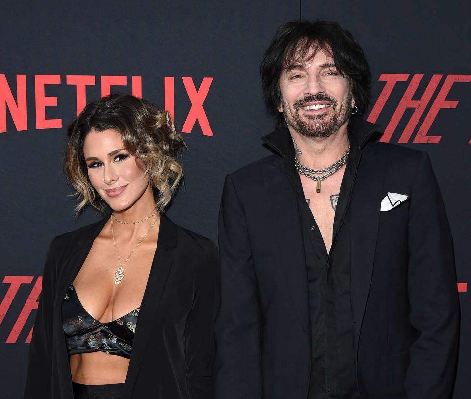 Tommy Lee and Brittany Furlan arrive at the premiere of Netflix's 'The Dirt' at ArcLight Hollywood on March 18, 2019 in Hollywood, California