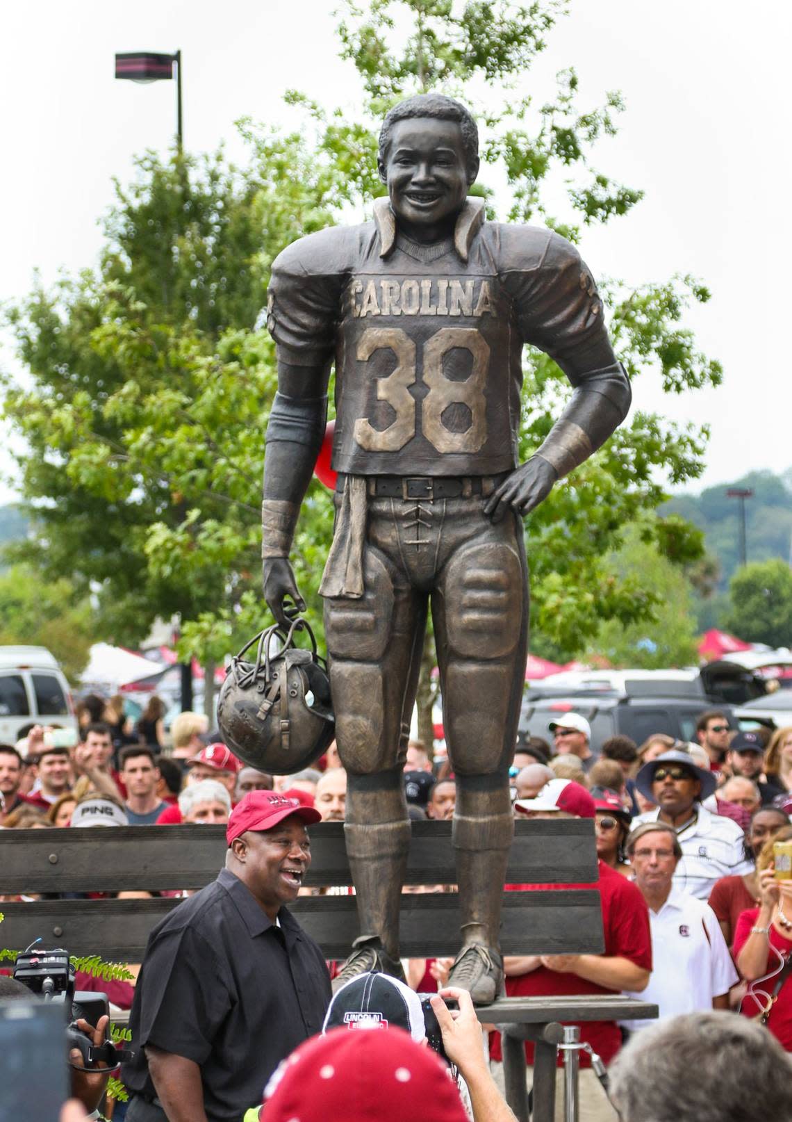 George Rogers poses with his statue that was unveiled during a ceremony before the South Carolina-Kentucky game in September 2015.