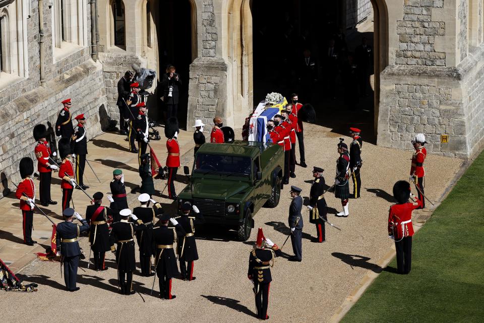 The Duke of Edinburgh’s casket, covered with his personal standard, is carried to a custom Land Rover hearse for his funeral at Windsor Castle on April 17, 2021.