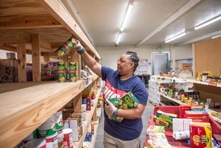 A worker organizes food at the West Alabama Food Bank in Northport, Alabama, U.S., on Monday March 28, 2022. Food banks and pantries across the U.S. are stretched so thin by soaring operating costs that they're having to ration what goes out to feed the nation's hungry. Photographer: Andi Rice/Bloomberg via Getty Images