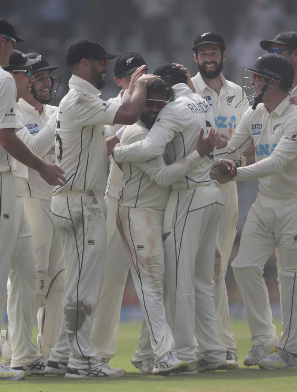 New Zealand's Ajaz Patel , center, celebrates the dismissal of India's Mohammed Siraj with his team players during the day two of their second test cricket match with India in Mumbai, India, Saturday, Dec. 4, 2021.(AP Photo/Rafiq Maqbool)