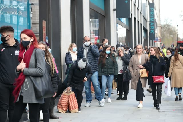 Shoppers queueing in Oxford Street, London