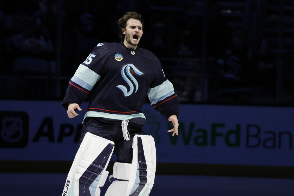 Seattle Kraken goaltender Joey Daccord (35) yells after the team's 4-1 win over the Ottawa Senators in an NHL hockey game Thursday, Jan. 4, 2024, in Seattle. (AP Photo/John Froschauer)