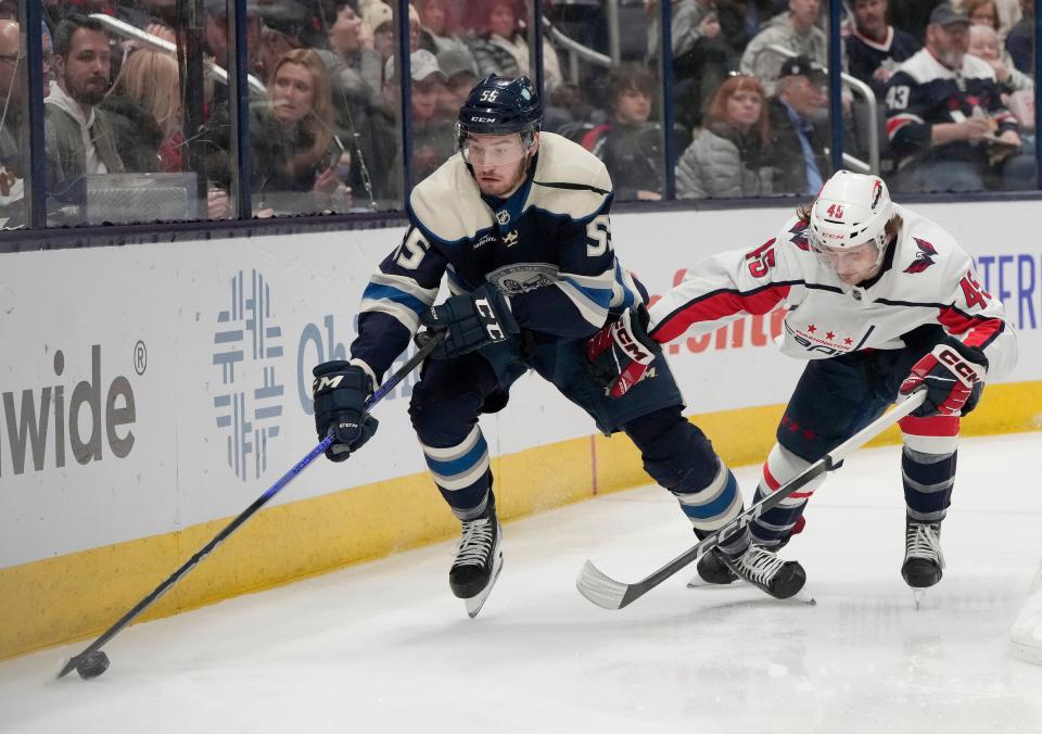 Dec. 201, 2023; Columbus, Ohio, USA; 
Columbus Blue Jackets defenseman David Jiricek (55) is pursued by Washington Capitals center Matthew Phillips (45) during the second period of a hockey game at Nationwide Arena on Thursday.