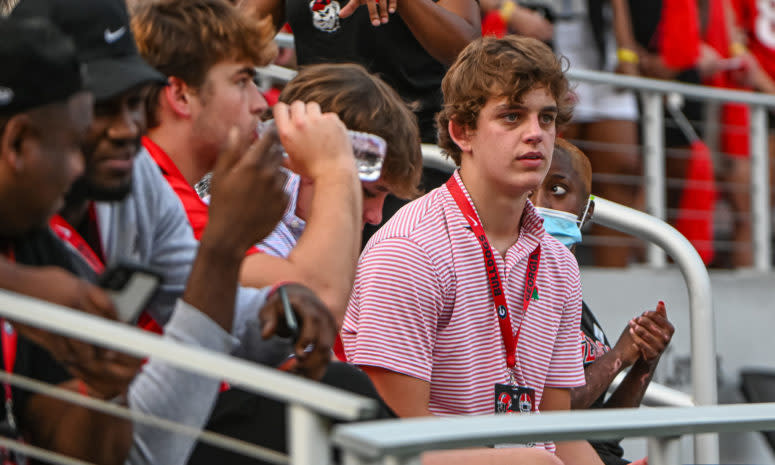 Arch Manning watching a Georgia game in the stands.