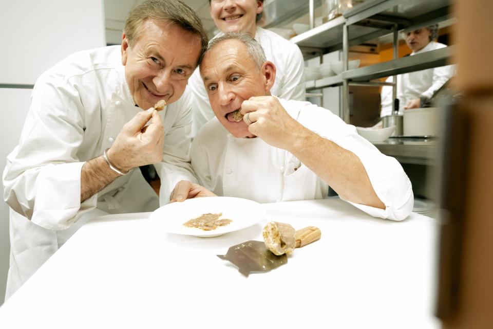 Michelin-starred chef Daniel Boulud shares truffles with longtime friend Marcello Fiorentino during a Palm Beach Food & Wine Festival dinner at Marcello's La Sirena restaurant in West Palm Beach.