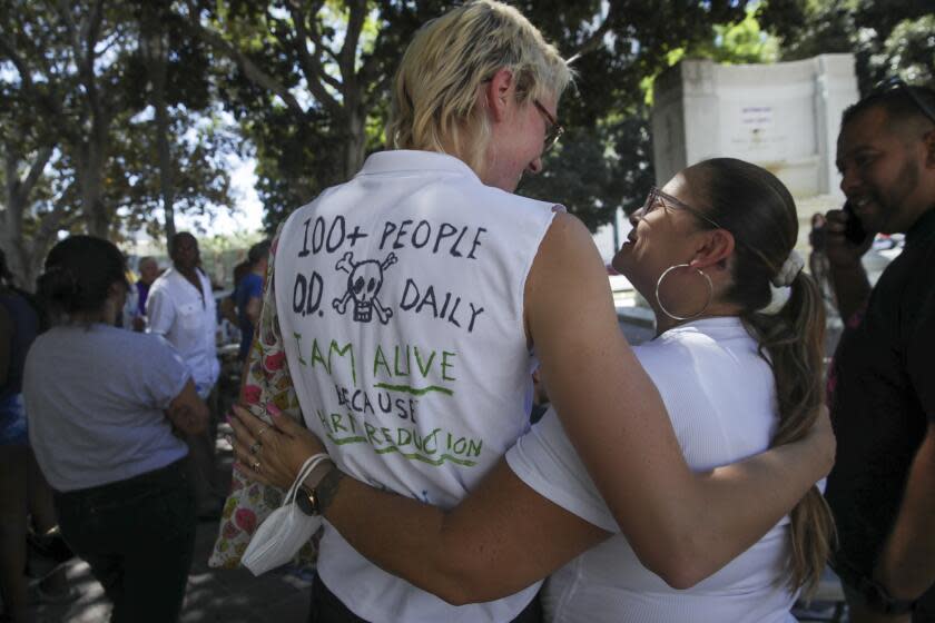 Los Angeles, CA - August 31: Two overdose survivors Finn Settles, 24, left, and Renee Arellano, 45, meet and greet each other at a rally held to mark International Overdose Awareness Day outside City Hall on Wednesday, Aug. 31, 2022 in Los Angeles, CA. (Irfan Khan / Los Angeles Times)