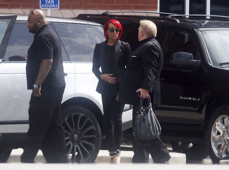 Singer Monica (C), arrives for the funeral of Kristina Bobbi Brown, the only child of singer Whitney Houston, at Saint James United Methodist Church in Alpharetta, Georgia, August 1, 2015. REUTERS/Tami Chappell