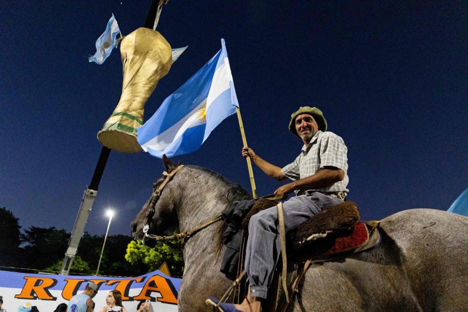 Argentina fans greeted their returning heroes in their swathes (AFP via Getty Images)