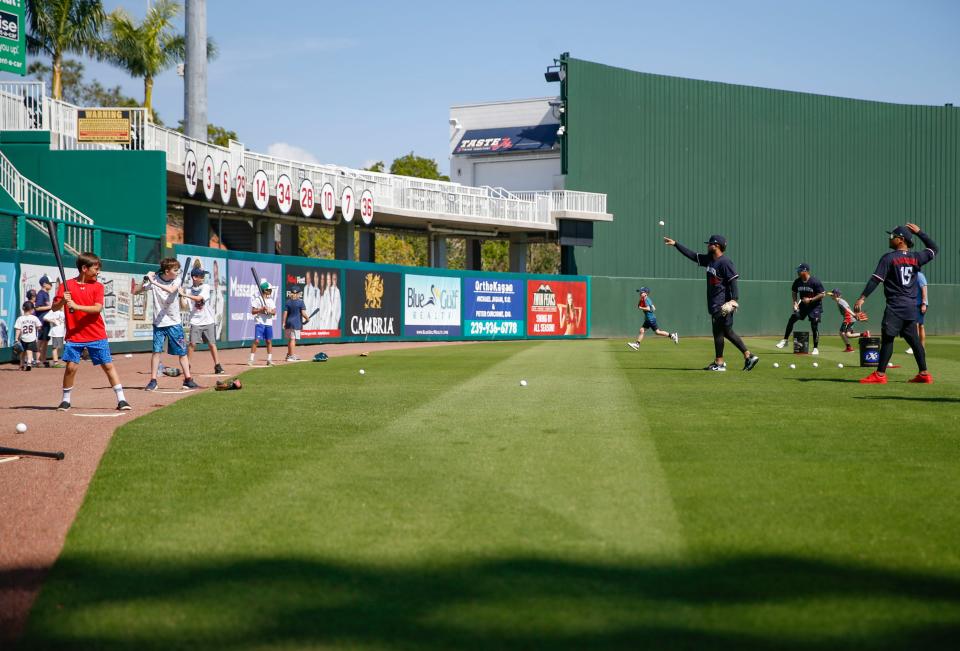 Minnesota Twins players throw whiffle balls to young fans after the first full-squad spring training workout for the team at Hammond Stadium in Fort Myers on Monday, Feb. 20, 2023. 