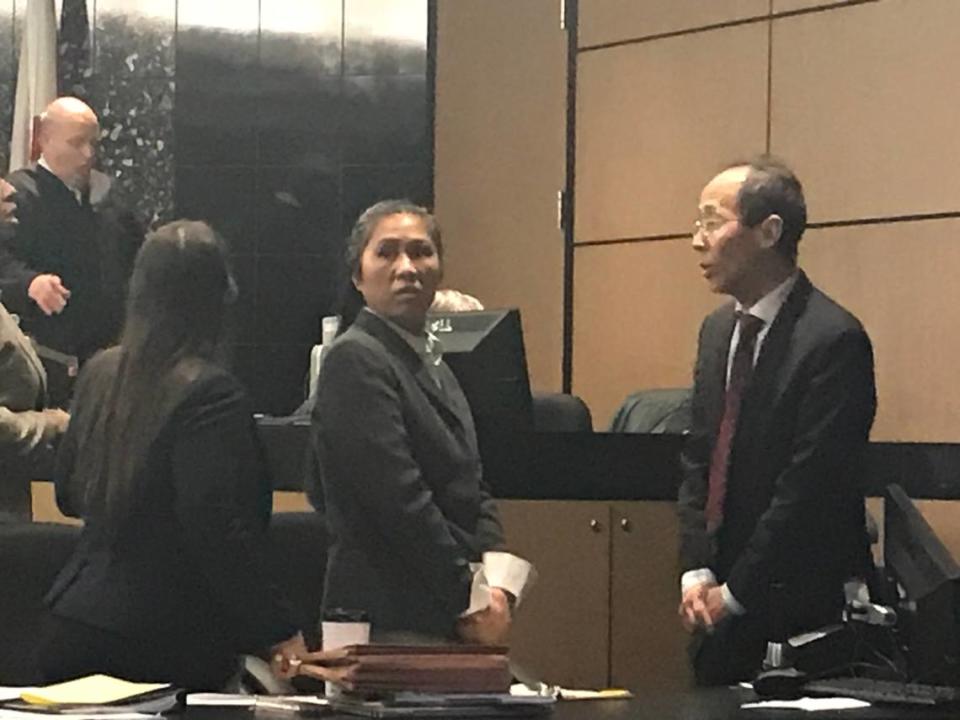 Lu Jing, charged with loitering and prowling at Mar-a-Lago, the South Florida home of President Trump, appears in court in Palm Beach County on Tuesday, Feb. 11, 2019. To her right is her interpreter.
