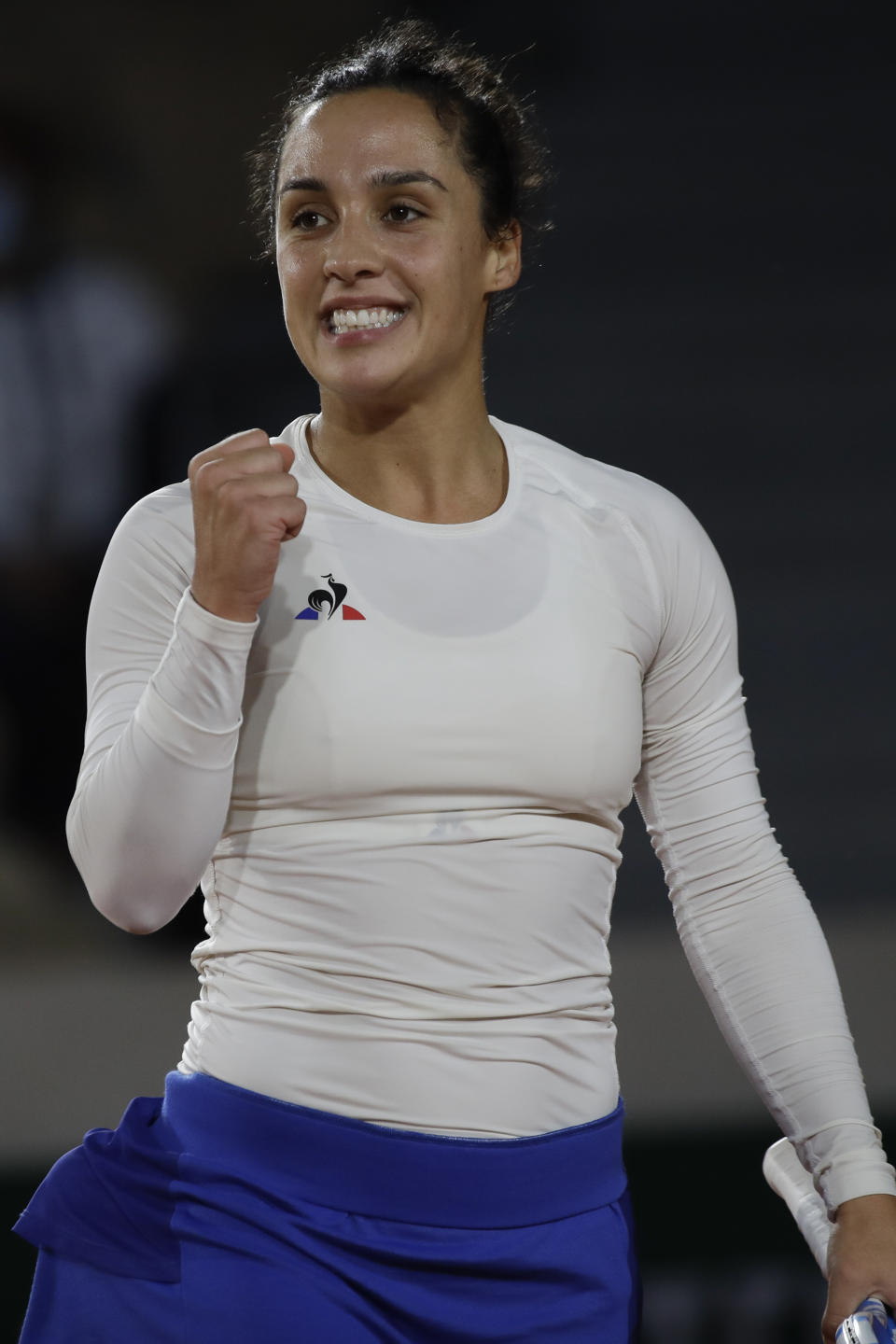 Italy's Martina Trevisan clenches her fist after scoring a point against Cori Gauff of the U.S. in the second round match of the French Open tennis tournament at the Roland Garros stadium in Paris, France, Wednesday, Sept. 30, 2020. (AP Photo/Alessandra Tarantino)