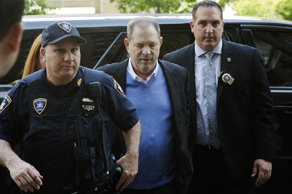 <p>Harvey Weinstein is escorted into court, Friday, May 25, 2018, in New York. The movie mogul turned himself in at a police precinct earlier Friday. (Photo: Mark Lennihan/AP) </p>