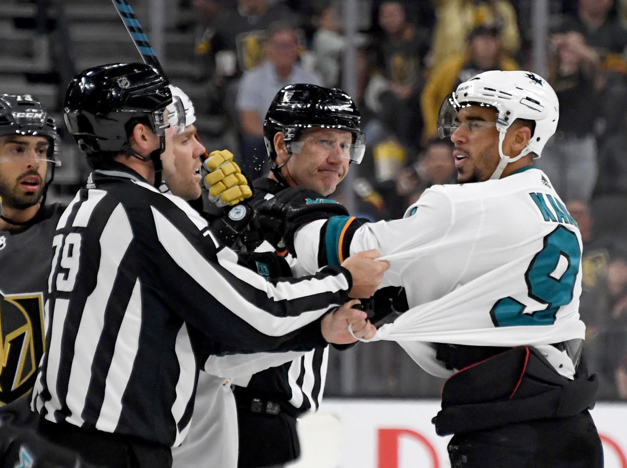 LAS VEGAS, NEVADA - SEPTEMBER 29:  Evander Kane #9 of the San Jose Sharks shoves linesman Kiel Murchison in the third period of the Sharks' preseason game against the Vegas Golden Knights at T-Mobile Arena on September 29, 2019 in Las Vegas, Nevada. Kane received a game misconduct for an abuse of officials penalty. The Golden Knights defeated the Sharks 5-1.  (Photo by Ethan Miller/Getty Images)