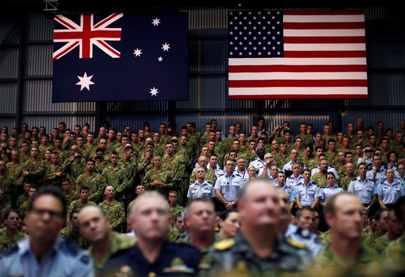 FILE PHOTO: Troops watch U.S. President Barack Obama speak to U.S. Marines and Australian troops at the RAAF Base in Darwin