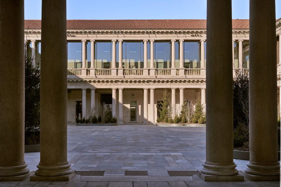 a building with pillars and a courtyard