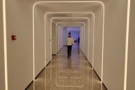 A staff member walks in the hallway during a demonstration to the media at Alibaba Group's futuristic FlyZoo hotel in Hangzhou, Zhejiang province, China January 22, 2019. REUTERS/Xihao Jiang