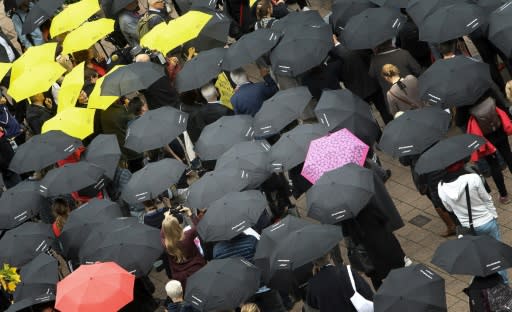 The umbrella vigil calls on the literary world to show solidarity and set an example for freedom of expression and freedom of the press