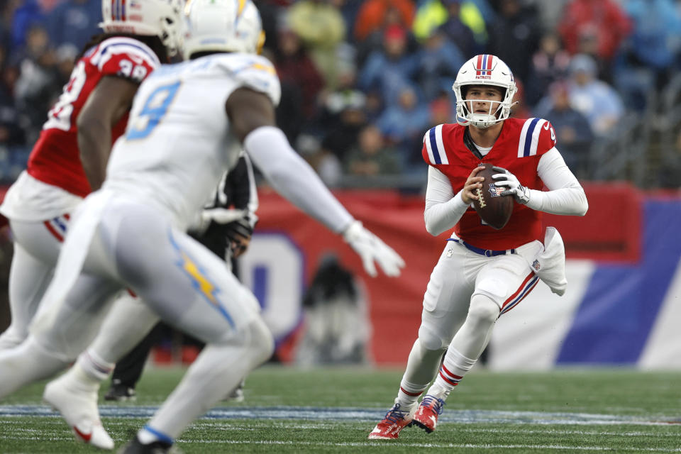 New England Patriots quarterback Bailey Zappe (4) runs for a gain against the Los Angeles Chargers during the first half of an NFL football game, Sunday, Dec. 3, 2023, in Foxborough, Mass. (AP Photo/Michael Dwyer)