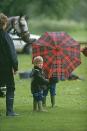 <p>Prince Harry stands on the sidelines of a polo match in Cirencester.</p>