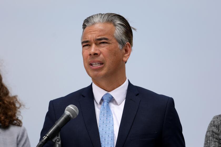 PLAYA DEL REY, CA - APRIL 28: California Attorney General Rob Bonta, flanked by his legal team, announced Thursday at Dockweiler State Beach that his office has launched an unprecedented investigation into the fossil fuel and petrochemical industries' alleged role in causing and exacerbating the plastic pollution crisis on Thursday, April 28, 2022 in Playa Del Rey, CA. (Gary Coronado / Los Angeles Times)