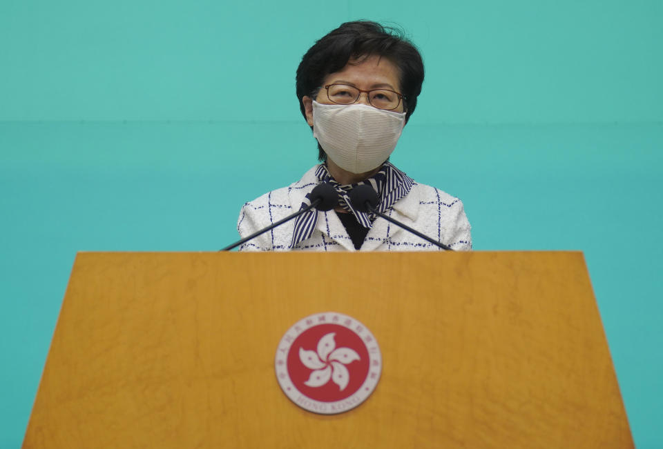 Hong Kong Chief Executive Carrie Lam listens to reporters' questions during a press conference in Hong Kong, Tuesday, June 16, 2020. Lam said she hoped that the opposition would not “demonize and stigmatize” the national security law as doing do would mean pitting themselves against the people of Hong Kong. (AP Photo/Vincent Yu)