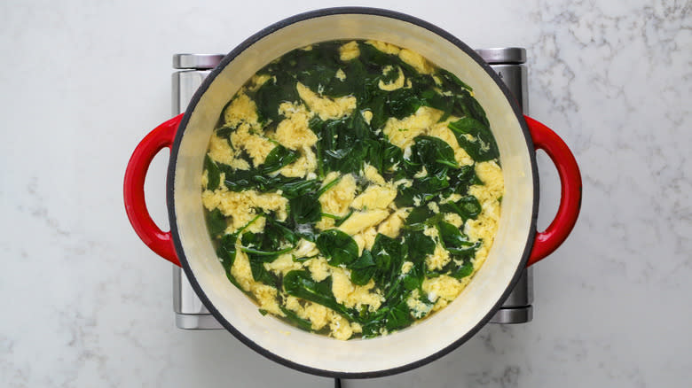 broth, egg, and spinach in pot