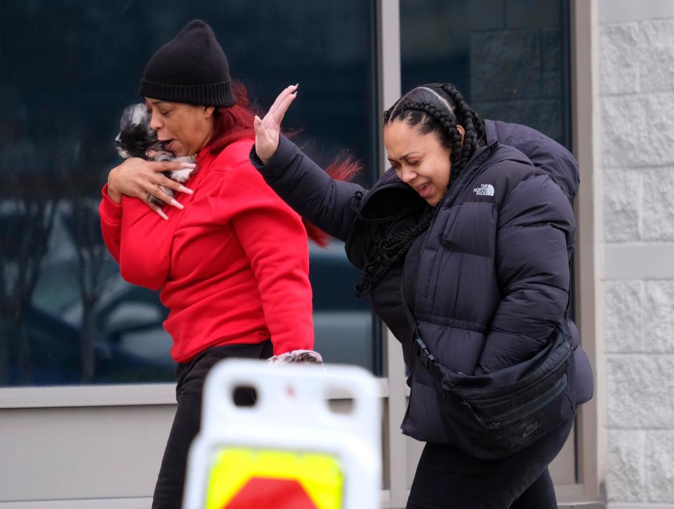 Two women brace against the north wind while going into a store in northwest Oklahoma City Tuesday, Jan. 9, 2024.