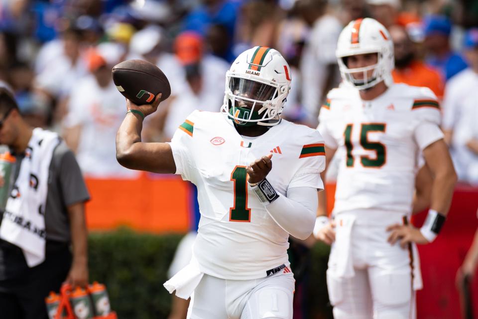 Aug 31, 2024; Gainesville, Florida, USA; Miami Hurricanes quarterback Cam Ward (1) throws the ball before a game against the Florida Gators at Ben Hill Griffin Stadium. Mandatory Credit: Matt Pendleton-USA TODAY Sports