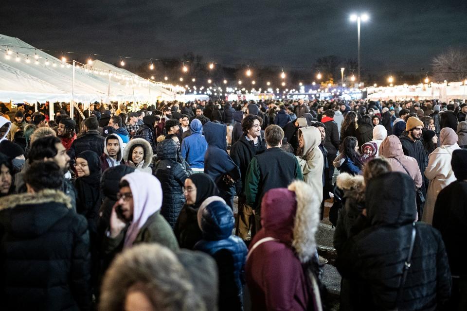 Festival goers line up in front of food vendors during the Ramadan Suhoor Festival at the Fairlane Town Center in Dearborn on Saturday, April 9, 2022.