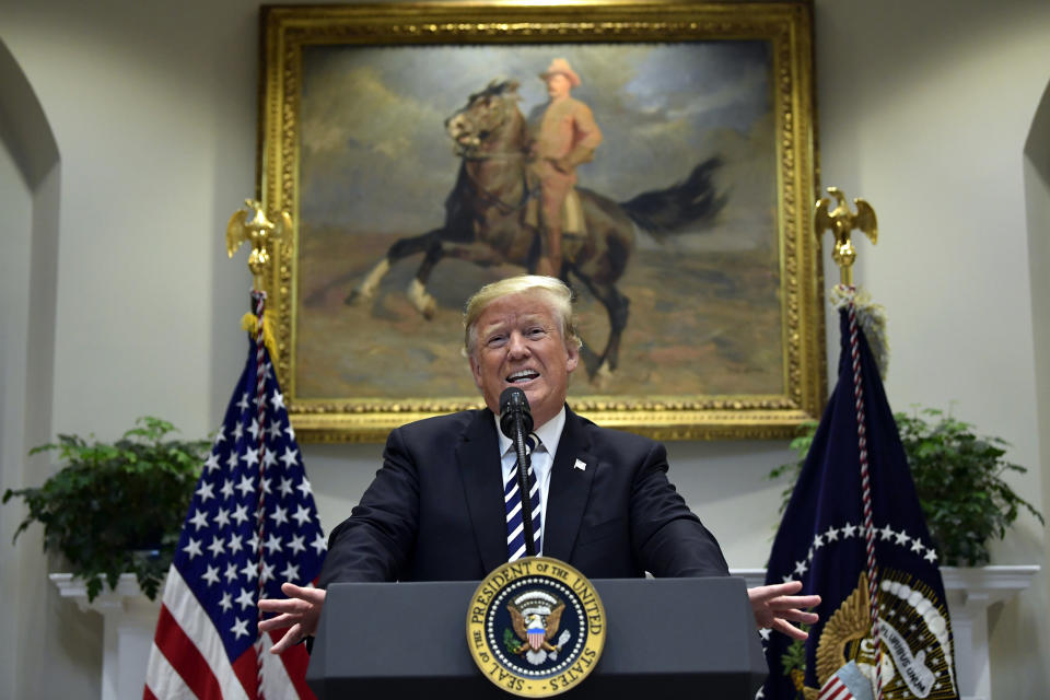 FILE - In this Nov. 1, 2018, file photo, President Donald Trump talks about immigration and gives an update on border security from the Roosevelt Room of the White House in Washington. Civil liberties groups have filed a lawsuit in federal court in San Francisco to block the Trump administration from returning asylum seekers to Mexico while their cases wind through U.S. immigration courts. The American Civil Liberties Union and other groups said in the suit filed Thursday, Feb. 14, 2019, that the policy puts asylum seekers in danger and violates U.S. immigration law. (AP Photo/Susan Walsh, File)