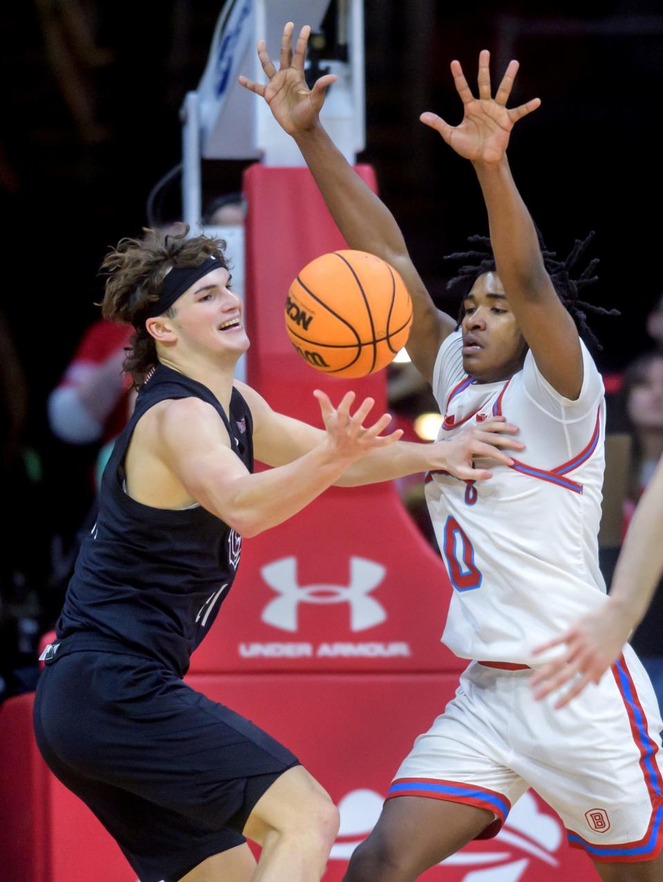 Missouri State's Nick Kramer, left, bobbles the ball as Bradley's Demarion Burch defends in the second half of their Missouri Valley Conference basketball game Saturday, Jan. 6, 2024 at Carver Arena in Peoria. The Braves defeated the Bears 86-60.