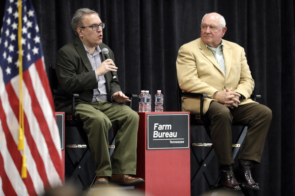 Acting EPA administrator Andrew Wheeler, left, and Agriculture Secretary Sonny Perdue answer questions Tuesday, Dec. 18, 2018, in Lebanon, Tenn. The two met with farmers about a new Trump administration proposal to redefine "waters of the United States." (AP Photo/Mark Humphrey)