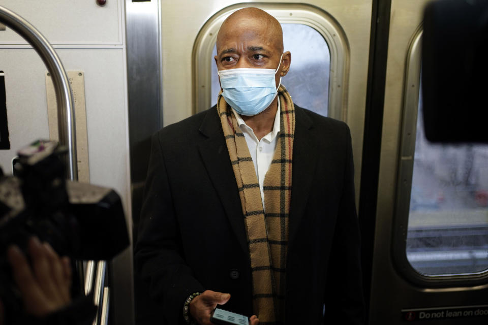 FILE — New York Mayor Eric Adams trides the subway to City Hall on his first day in office in New York, Jan. 1, 2022. Adams says the New York City subway system must be safe and New Yorkers must "feel safe" in the system. (AP Photo/Seth Wenig, File)