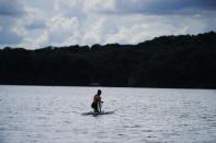 Canoe sprint world champion Nevin Harrison, 19, of Seattle, trains near Lake Lanier Olympic Park on Thursday, July 1, 2021, in Gainesville, Ga. Harrison won the world championship in the women's sprint canoe 200 meters as a 17-year-old in 2019. Now she'll try to duplicate that at the Olympics in Tokyo where the race will be a new event in a bid for gender equity. (AP Photo/Brynn Anderson)