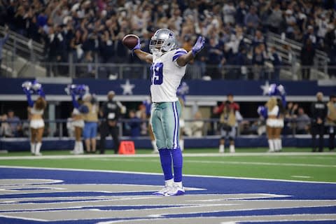 Dallas Cowboys wide receiver Amari Cooper (19) celebrates scoring a 75 yard touchdown pass in the fourth quarter against the Philadelphia Eagles at AT&T Stadium - Credit: Tim Heitman/USA TODAY