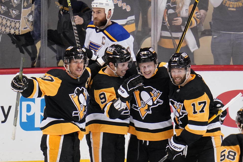 Pittsburgh Penguins' Evan Rodrigues (9) celebrates his goal during the third period of an NHL hockey game against the St. Louis Blues in Pittsburgh, Wednesday, Jan. 5, 2022. The Penguins won 5-3. (AP Photo/Gene J. Puskar)