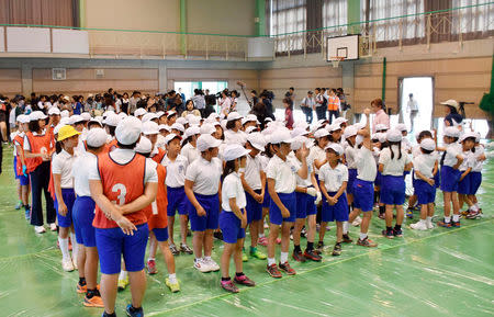 Elementary school students take part in an evacuation drill for a simulated North Korean missile attack, in Abu, Yamaguchi prefecture, Japan in this photo taken by Kyodo June 4, 2017. Mandatory credit Kyodo/via REUTERS