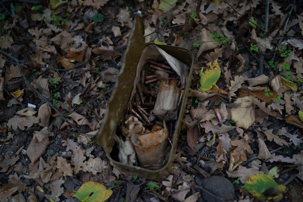 A box with ammunition lies on the ground where trenches were dug by Russian soldiers in a retaken area in Kherson region, Ukraine, Wednesday, Oct. 12, 2022.