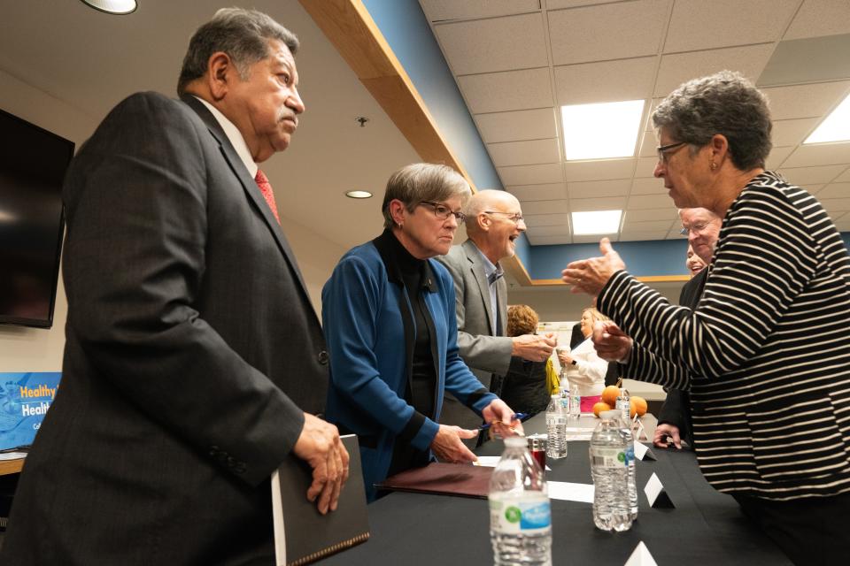 Gov. Laura Kelly, middle, listens to Topeka City Council member Karen Hiller, right, and Topeka Mayor Mike Padilla, left, after Tuesday's roundtable discussion over Medicaid expansion at Valeo Behavioral Health.