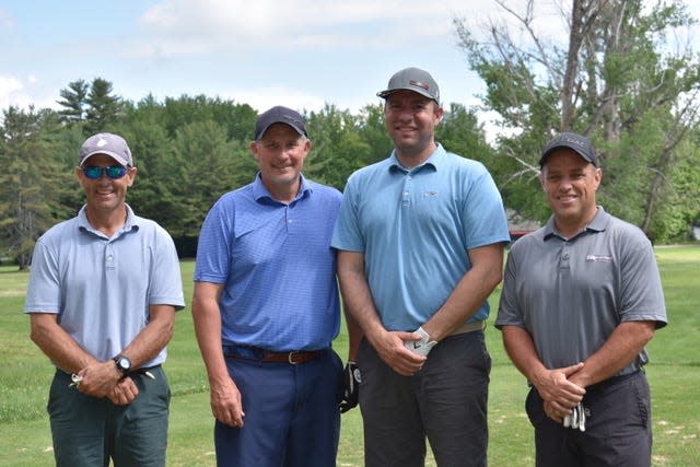 All smiles for the winning team at the Life Bridge Golf Tournament: Ben Ekstrom, Bret Chaveree, Garret Walston and Adam Dow