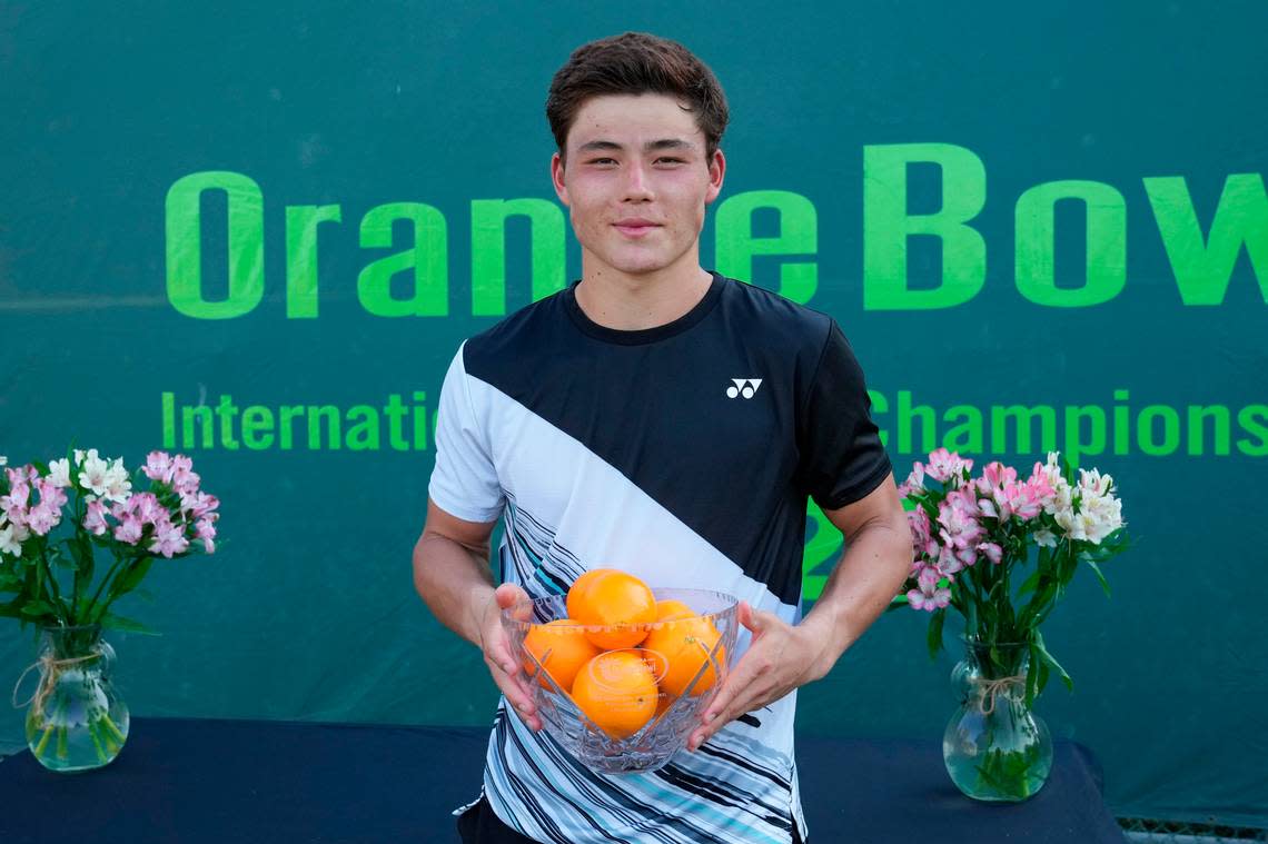 December 11, 2022 – Gerard Campana Lee, the 18 and Under Champion poses with the trophy at the Orange Bowl International Tennis Championships at the Veltri Tennis Center in Plantation, Florida.