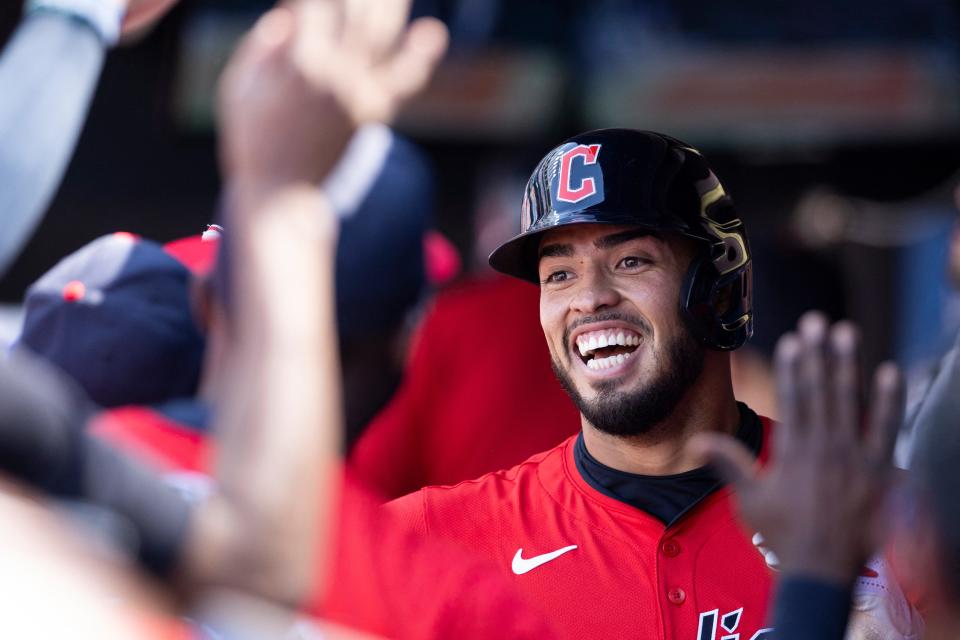 Guardians shortstop Gabriel Arias gets high-fives from teammates following his solo home run during the fifth inning against the New York Yankees, April 14, 2024, in Cleveland.