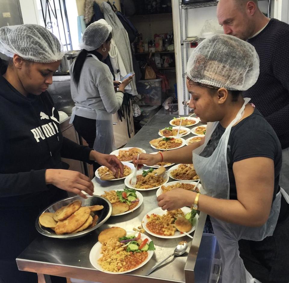 Helpers at the Brixton Soup kitchen prepare meals for people who are homeless (Brixton Soup Kitchen)