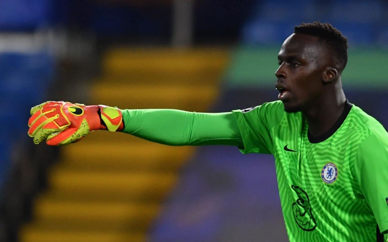 Chelsea's French goalkeeper Edouard Mendy gestures during the UEFA Champions League first round Group E football match between Chelsea and Sevilla - GLYN KIRK/POOL/AFP via Getty Images