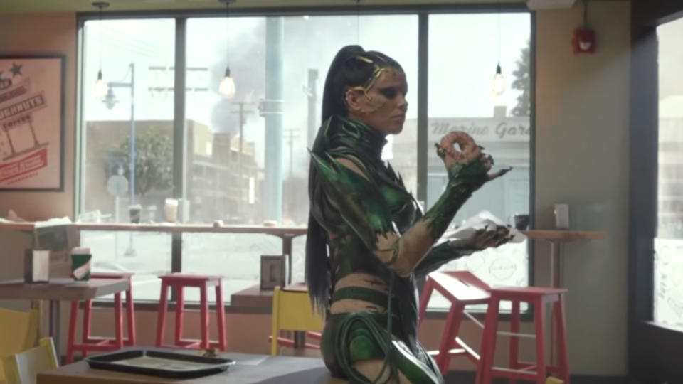 Elizabeth Banks pauses for a doughnut in 'Power Rangers'. (Credit: Lionsgate)