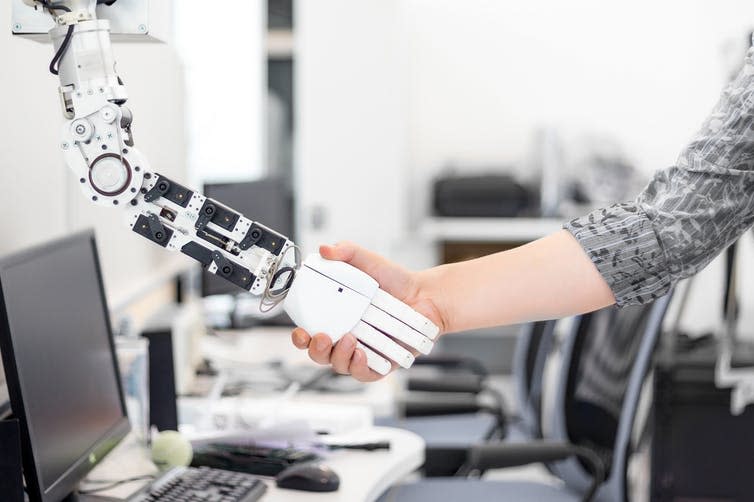 <span class="caption">Machines and humans could soon be working hand in hand.</span> <span class="attribution"><a class="link " href="https://www.shutterstock.com/fr/image-photo/robot-man-handshake-375746188?src=2K0_5-Wn7OLh1ba-mdarcQ-1-86" rel="nofollow noopener" target="_blank" data-ylk="slk:Borkin Vadim/Shutterstock;elm:context_link;itc:0;sec:content-canvas">Borkin Vadim/Shutterstock</a></span>