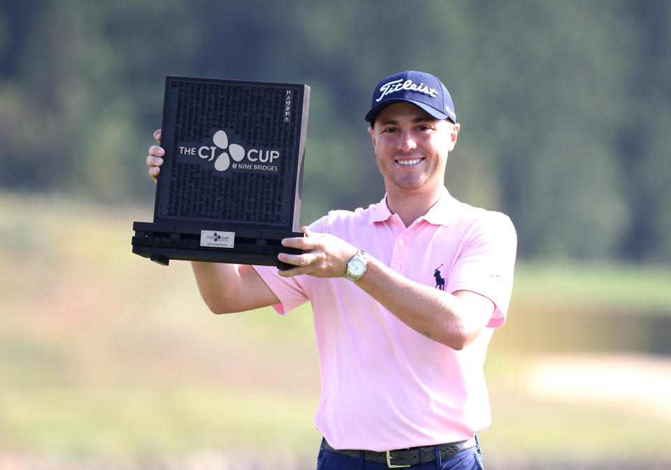 Justin Thomas of the United States poses with his trophy after winning the CJ Cup PGA golf tournament at Nine Bridges on Jeju Island, South Korea, Sunday, Oct. 20, 2019. (Park Ji-ho/Yonhap via AP)
